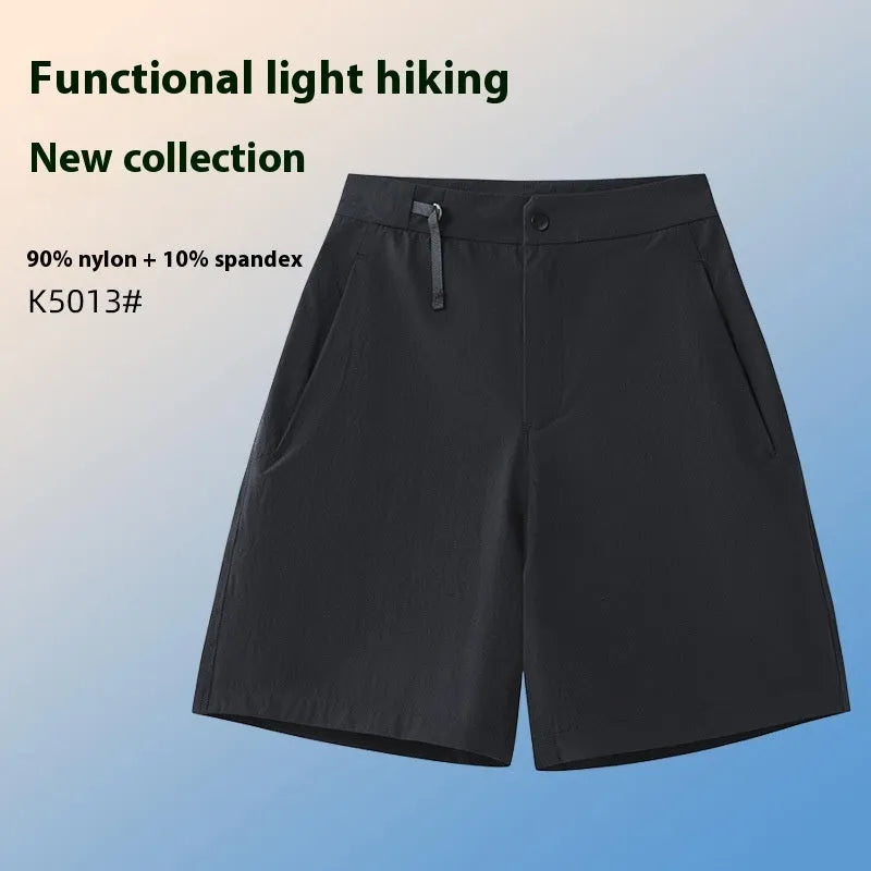 Men's quick-drying sports shorts in khaki colour with 3D cut and elastic waistband on a plain background.