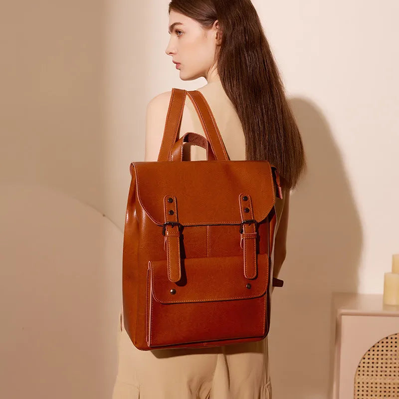 Genuine leather cowhide backpack with hard texture construction and internal lining for laptop organisation