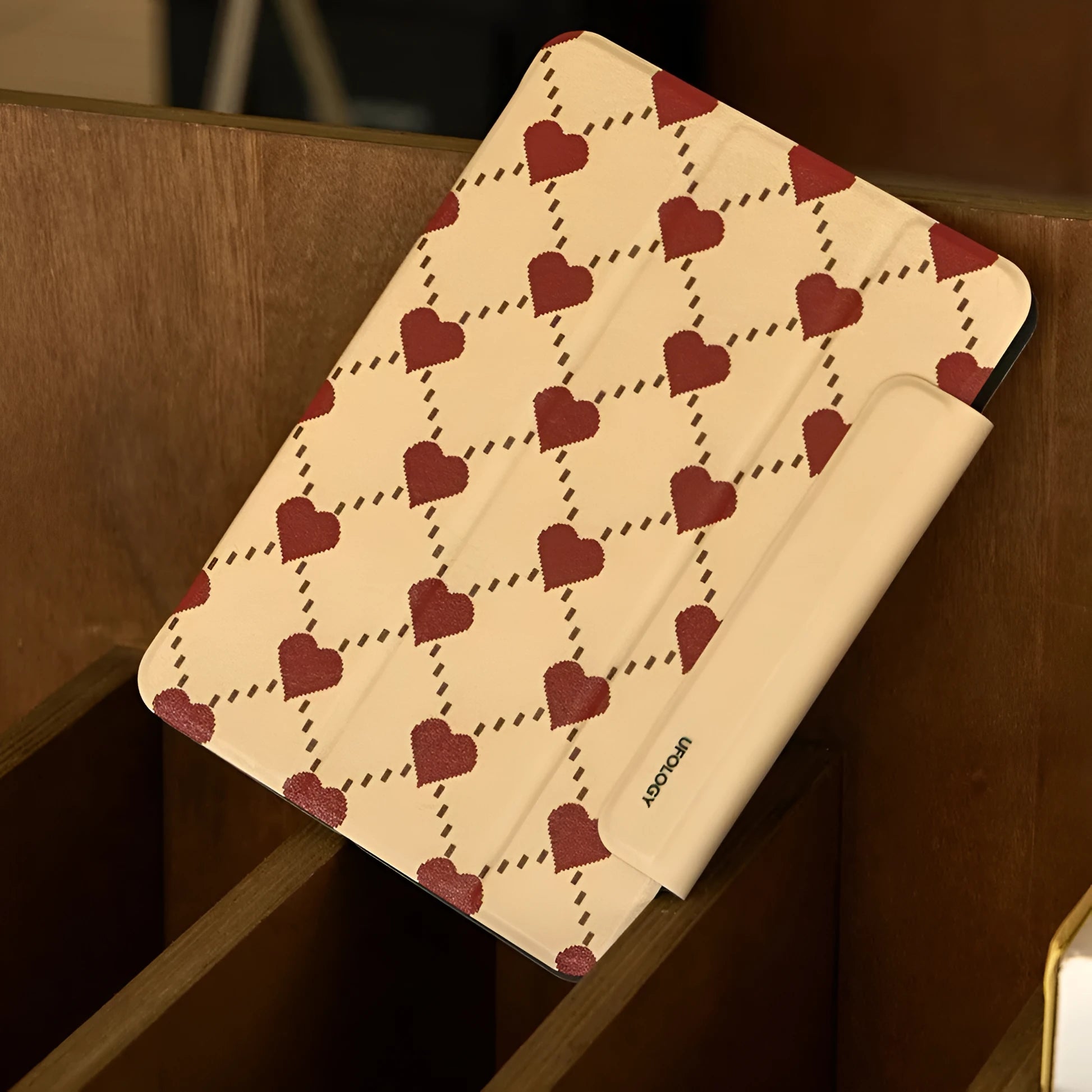 Black polyurethane magnetic case for iPad Air 5/Air 4 with a double-sided suction clip attached to a fridge.