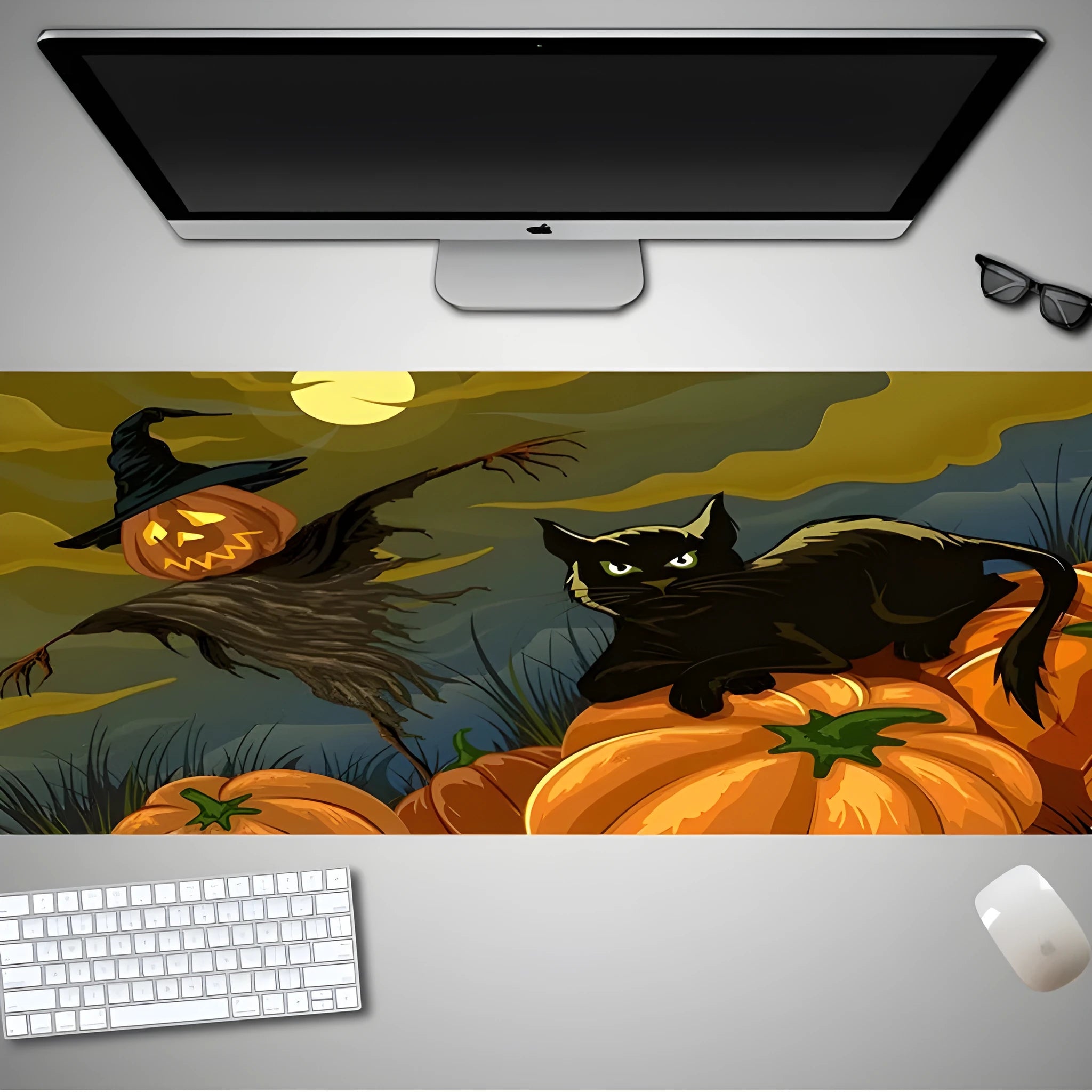 Oversized Halloween-themed mouse pad with non-slip rubber base on a desk.