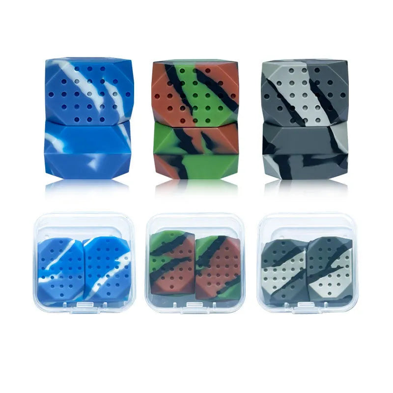 Two camouflage-pattern silicone facial muscle fitness balls for jawline training.