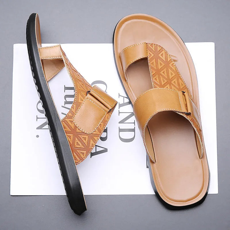 Men's light brown open-toe beach slippers made of cowhide with a rubber sole, shown on a neutral background.