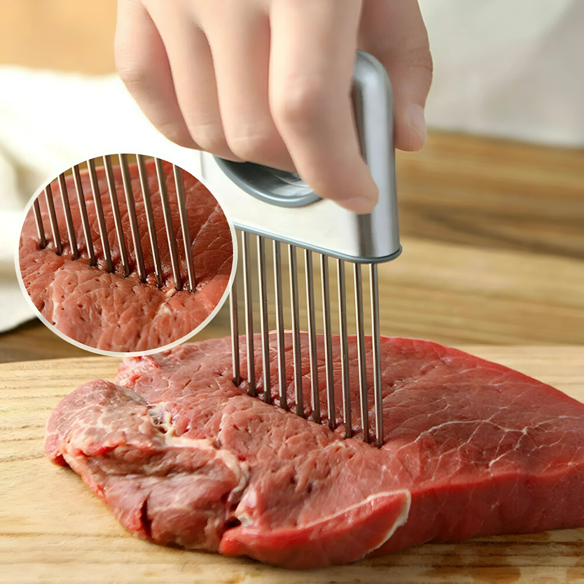 Stainless steel onion holder slicer with prongs and finger guard on a chopping board