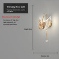 Modern gold swan-shaped wall lamp with acrylic shade and dimmable LED light.
