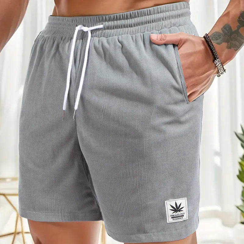 Men's black drawstring summer shorts with straight leg on a mannequin