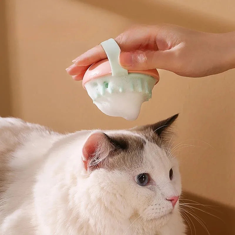 Blue silicone pet bathing brush with soft nubs for massaging and cleaning cats or dogs.