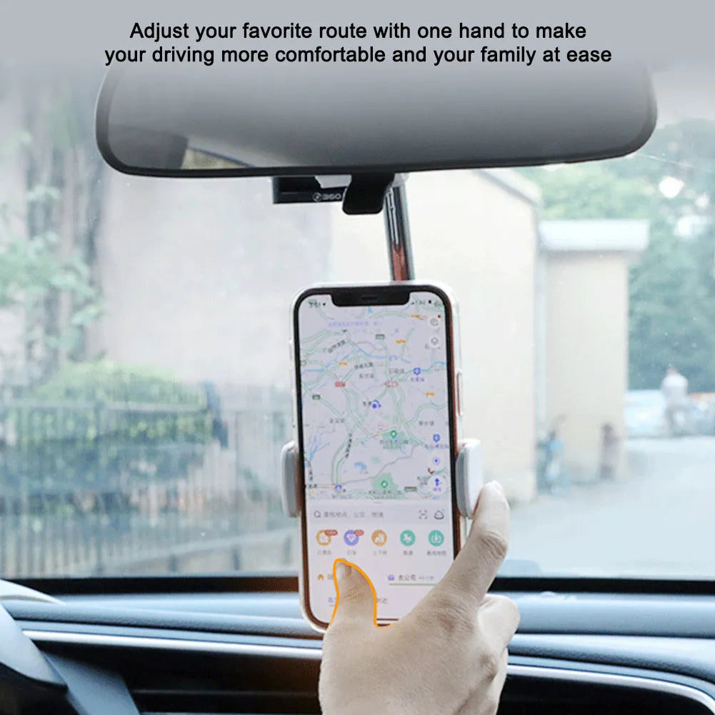 Black ABS car phone holder mounted on a rearview mirror showing 360-degree rotation mechanism
