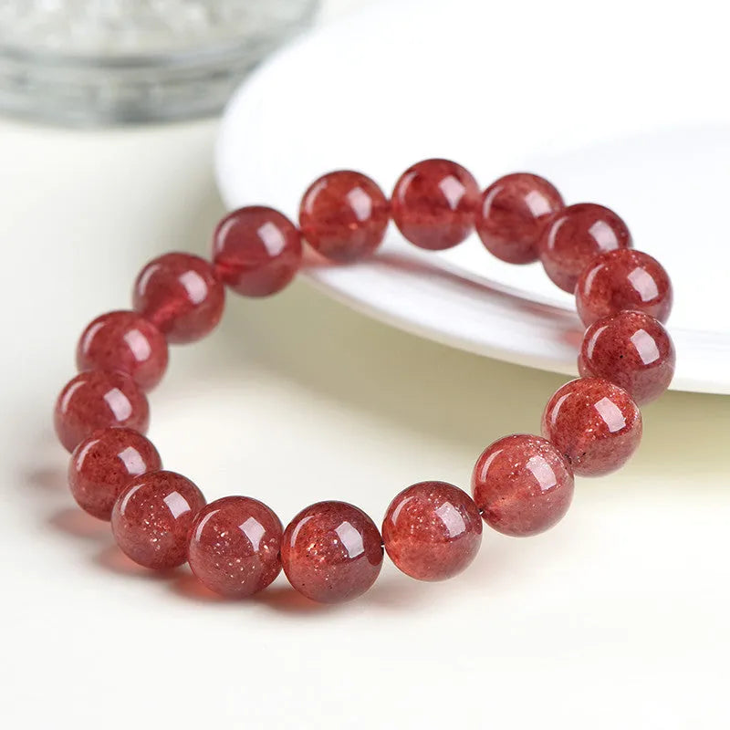 Natural strawberry quartz crystal bracelet with polished red geometry beads, shown in 3A and 5A grade options.