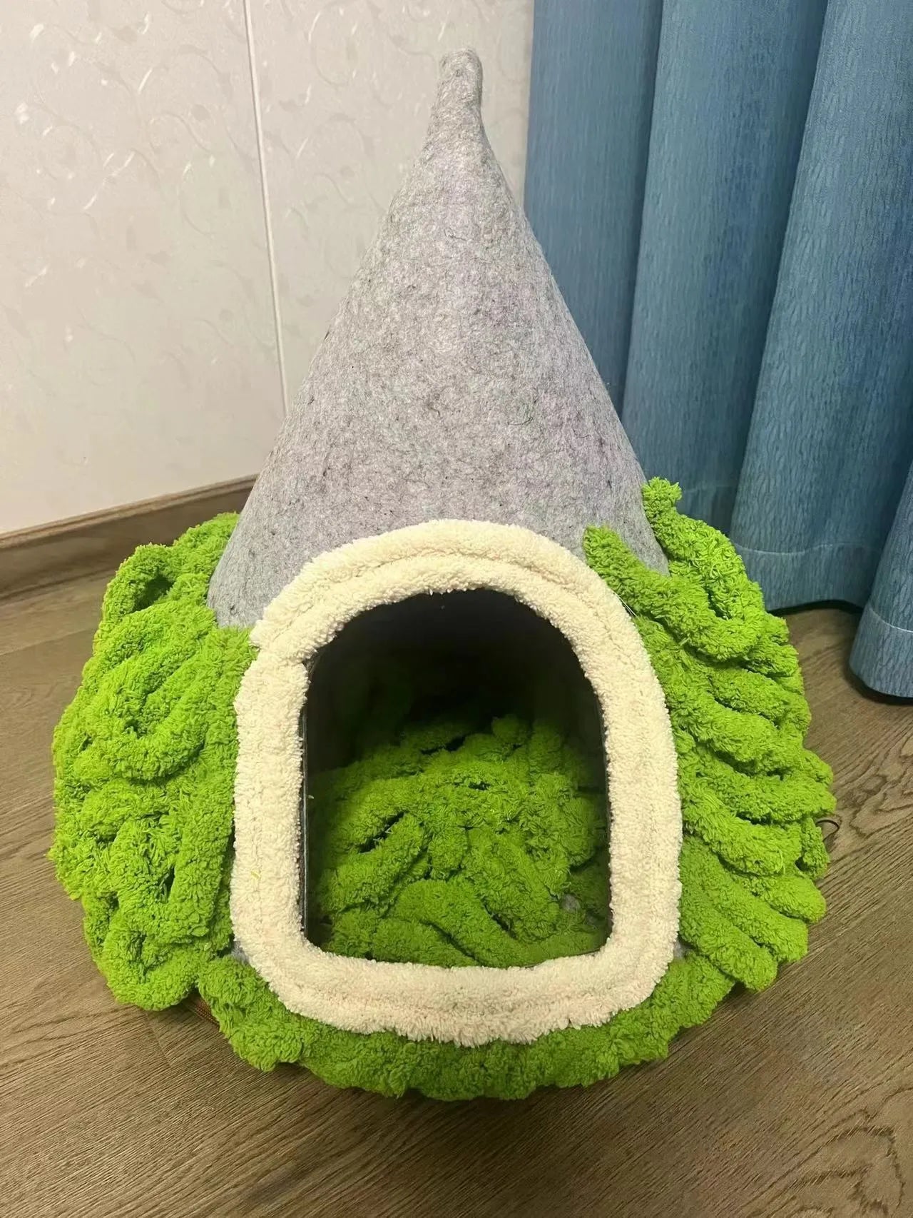 Grey conical felt cat house tent with circular base for indoor use