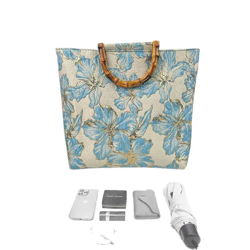 Women's light blue canvas bag with bronzing flower detailing and double shoulder straps