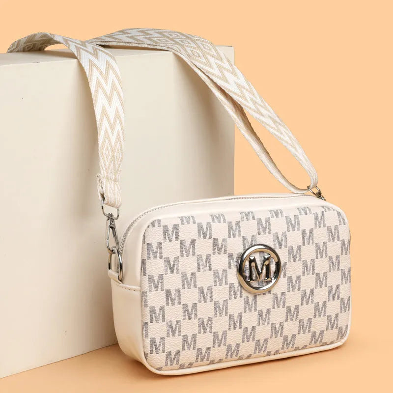 PU leather crossbody bag with wide shoulder strap and three-dimensional front pocket