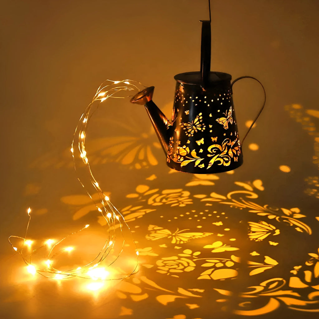 Solar-powered iron garden lamp with a tapered butterfly design in warm white.