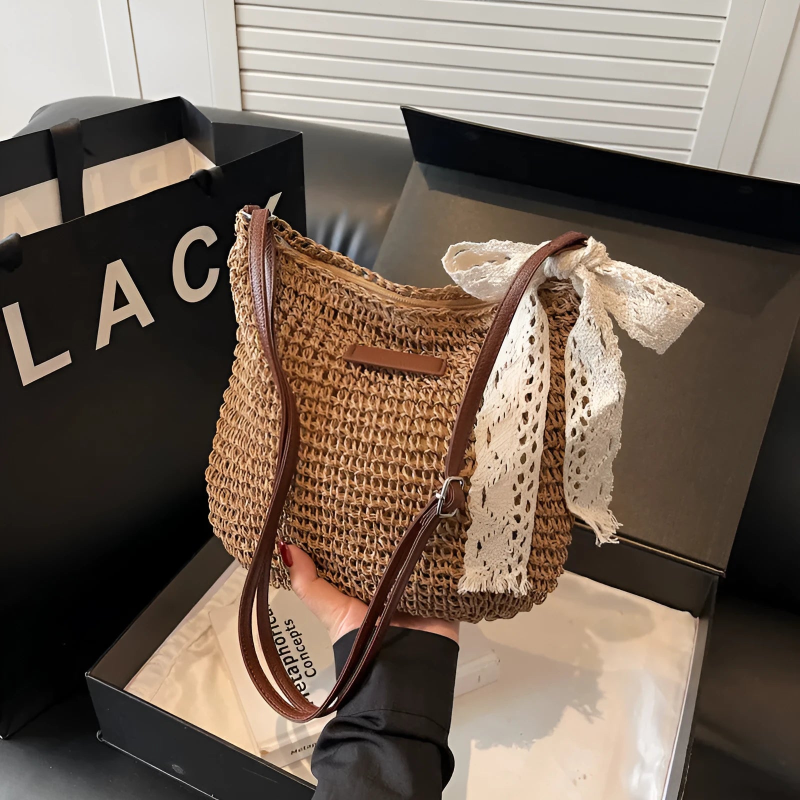 Women's woven straw messenger bag with hollowed pattern design in beige colour