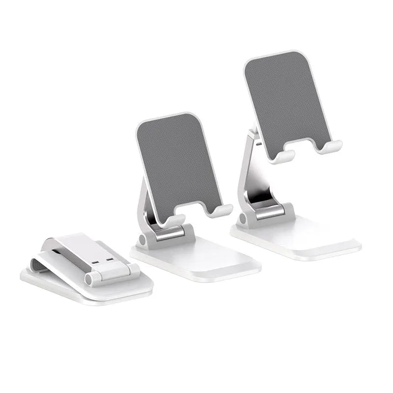 Universal folding portable desktop phone stand in weighted pearl white colour on a wooden table.