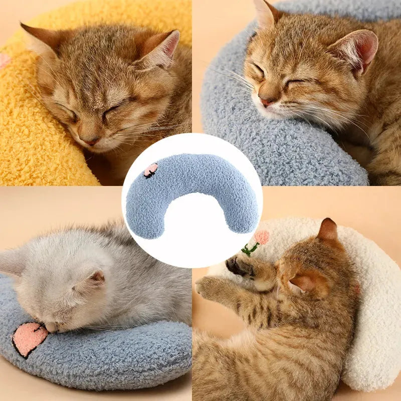 A blue U-shaped plush pet pillow for a cat or small dog on a white background.