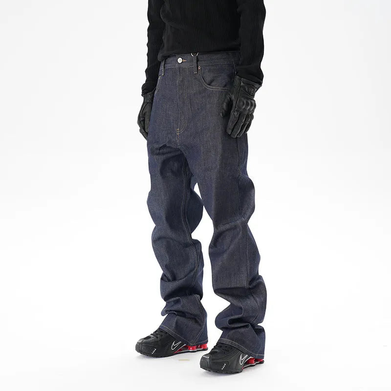 Man wearing dark blue loose straight-leg casual jeans.