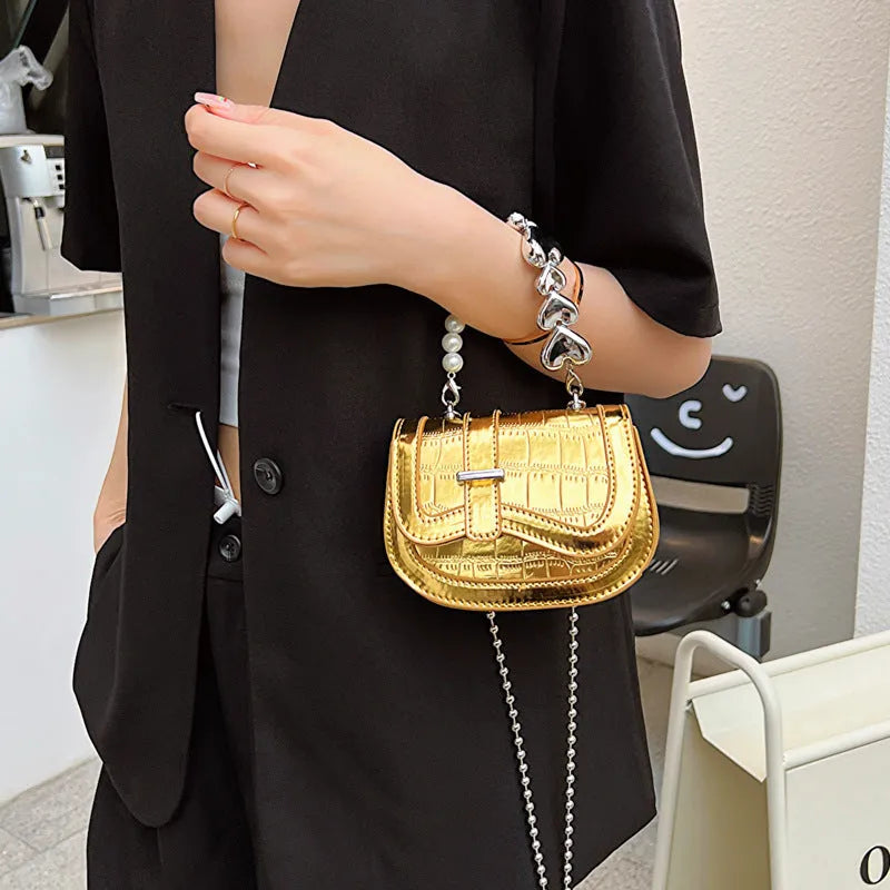 Women's silver PU mini saddle crossbody bag with phone pocket and single shoulder strap