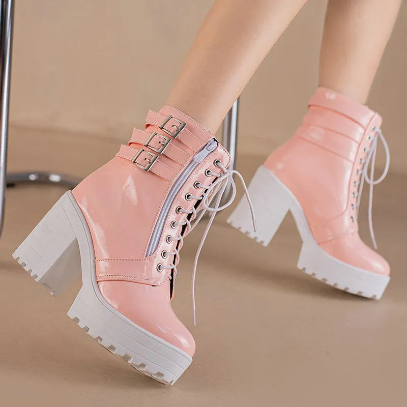 Women's black chunky heel ankle boots with lace-up front and round toe.