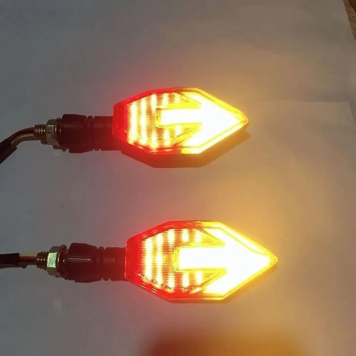 Arrow-shaped LED motorcycle turn signal indicator light with 12V connector.