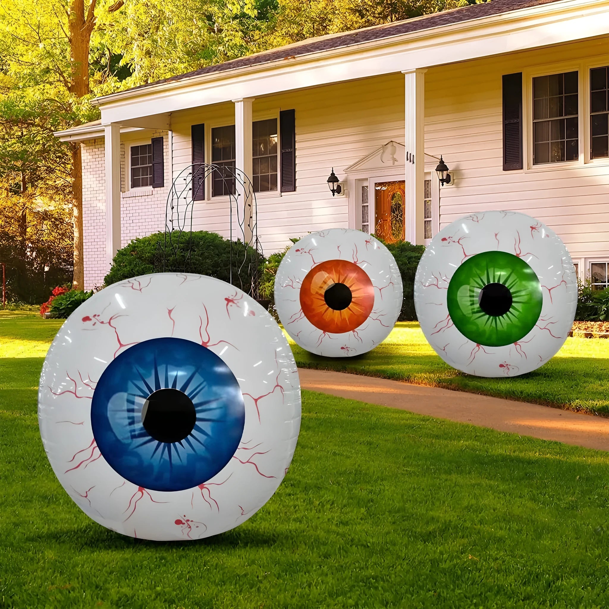 Green Halloween eyeball inflatable balloon with red bloodshot veins, shown inflated