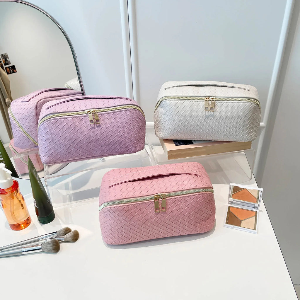Waterproof large capacity PU storage bag in white, open showing cosmetics inside