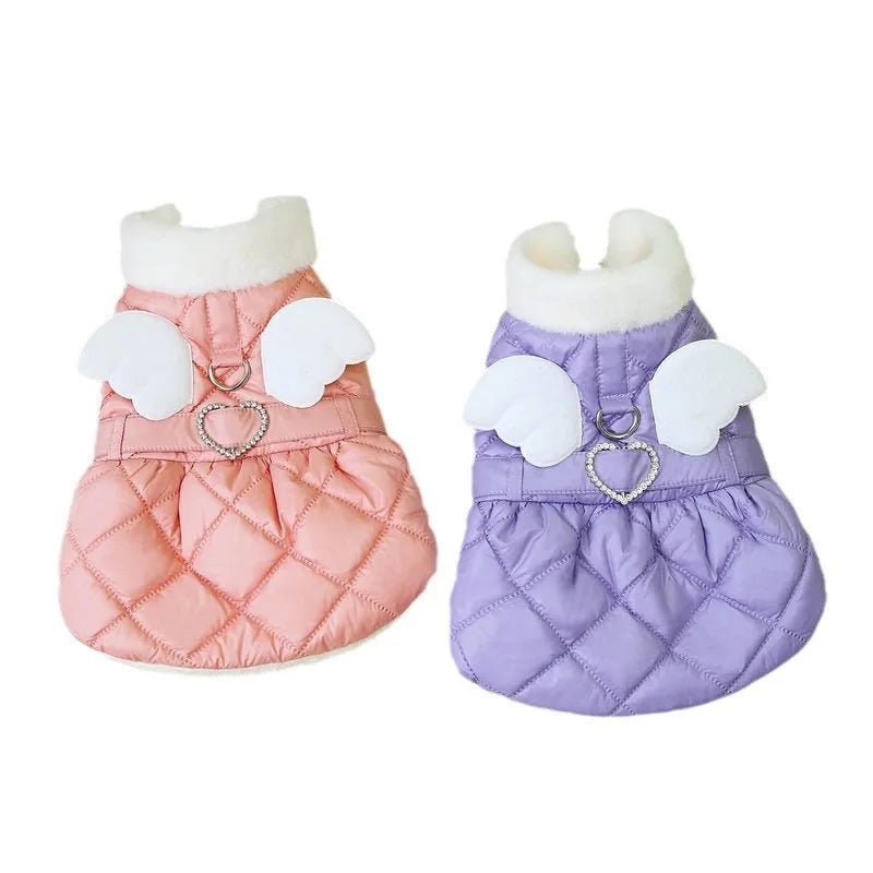Small dog wearing pink angel design skirt with adjustable belly strap