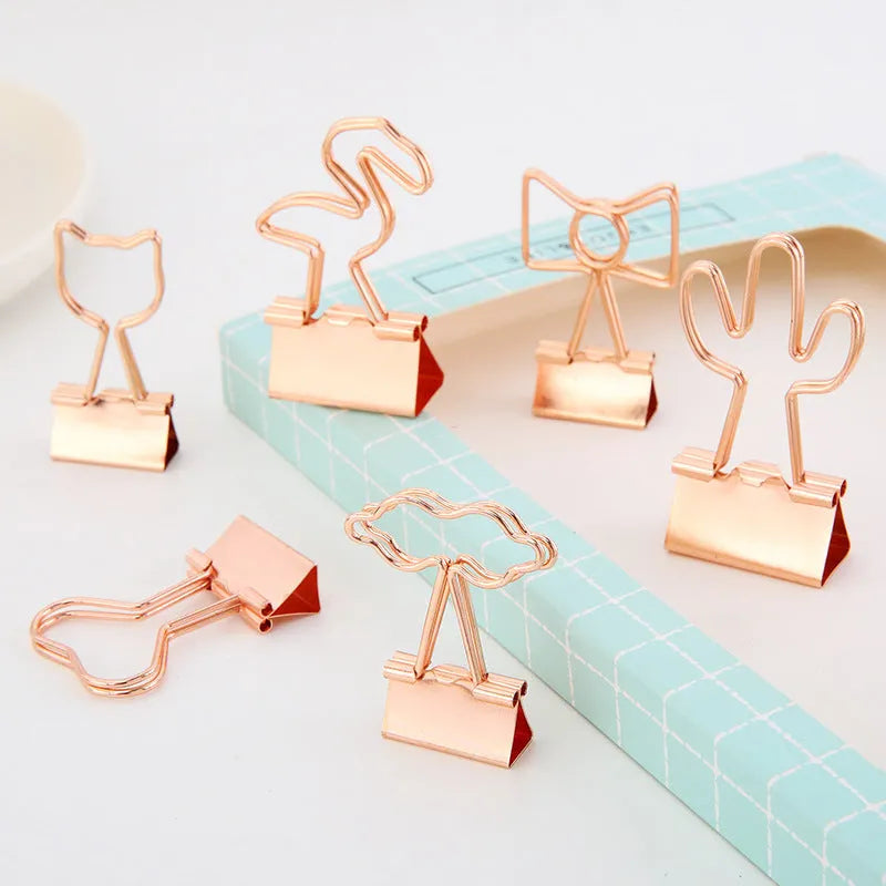Gold-coloured metal alligator hair clip in a choice of flamingo, love, cloud, cat, cactus, or bow shapes.