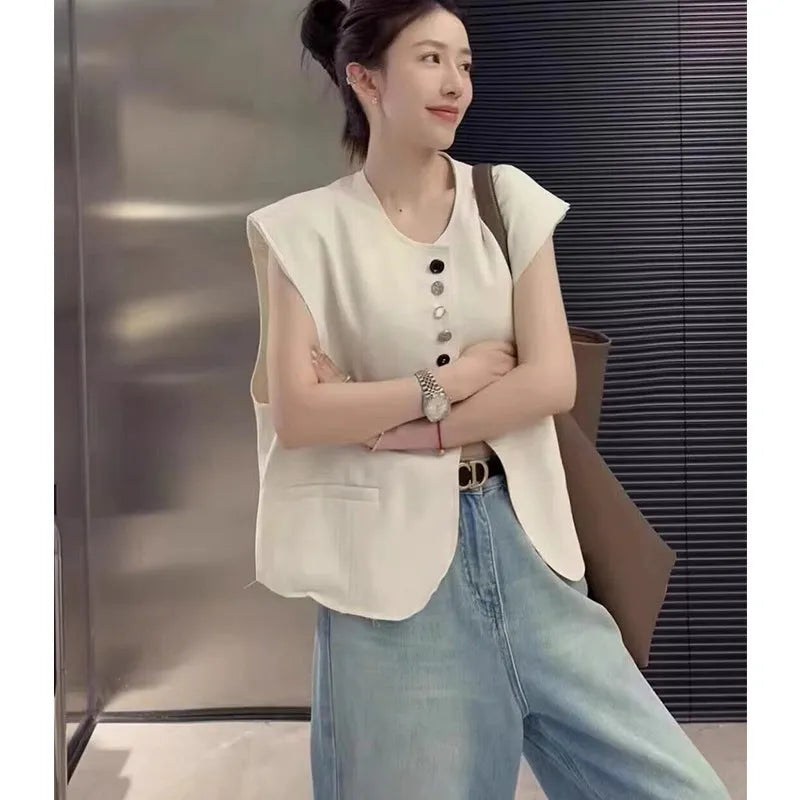 Women's short length polyester vest in milky white with front pockets
