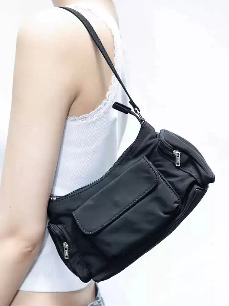 Black PU women's shoulder bag with double pockets and side line detail.