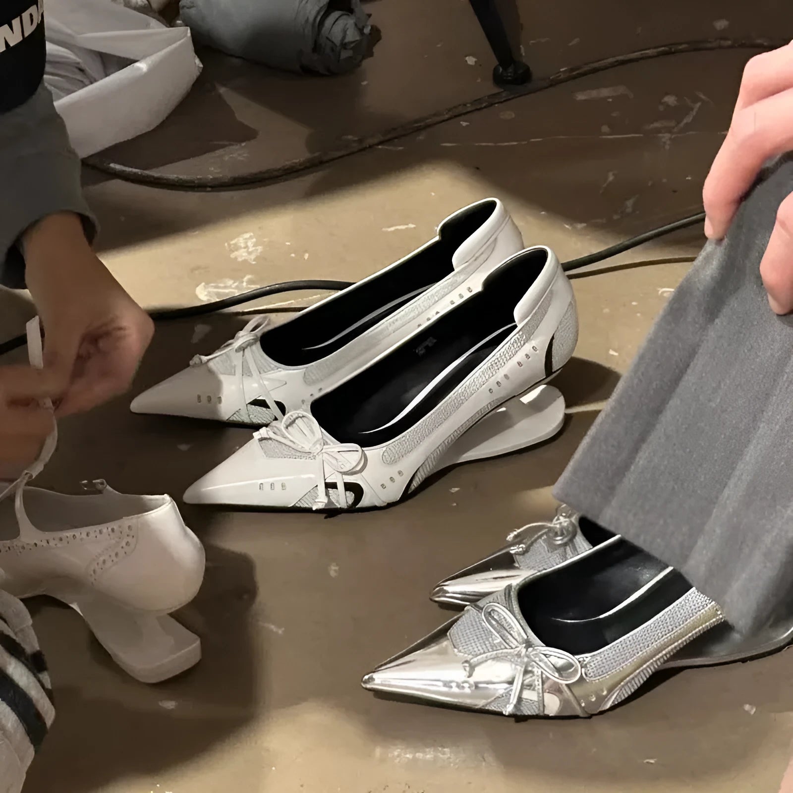 Black women's Mary Jane shoes with a pointed toe and a unique floating special-shaped heel.