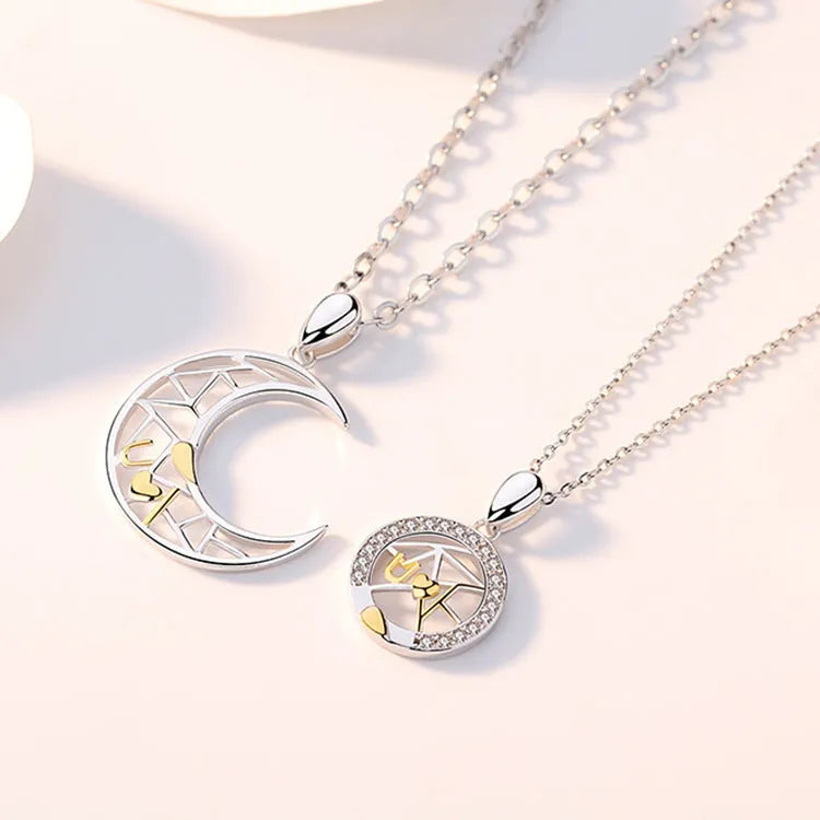 Copper sun and moon tooth couple necklace set with electroplated finish on a cross chain.
