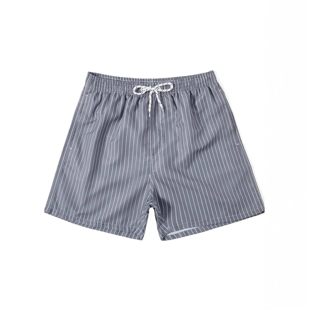 Men's navy blue and grey striped polyester beach shorts with straight leg opening.