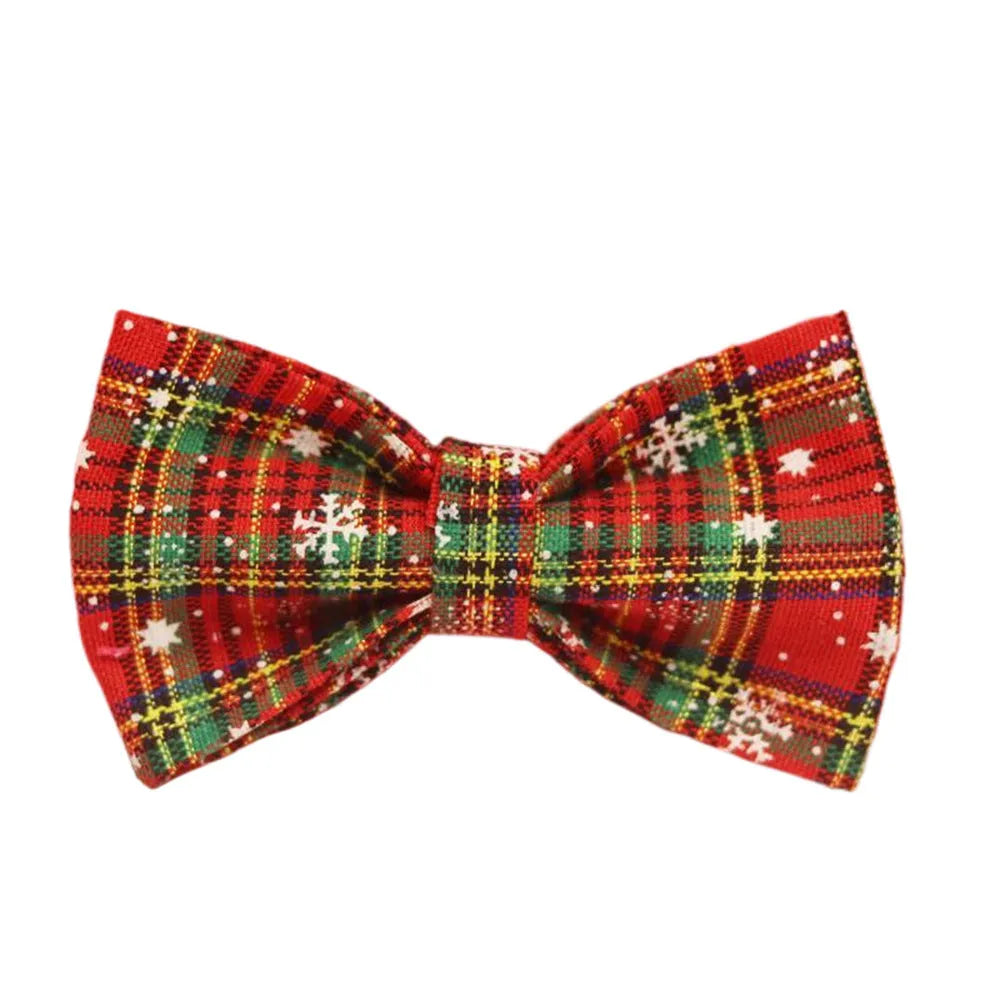 Red snowflake plaid fabric pet collar and leash set with matching dog vest and decorative bow.