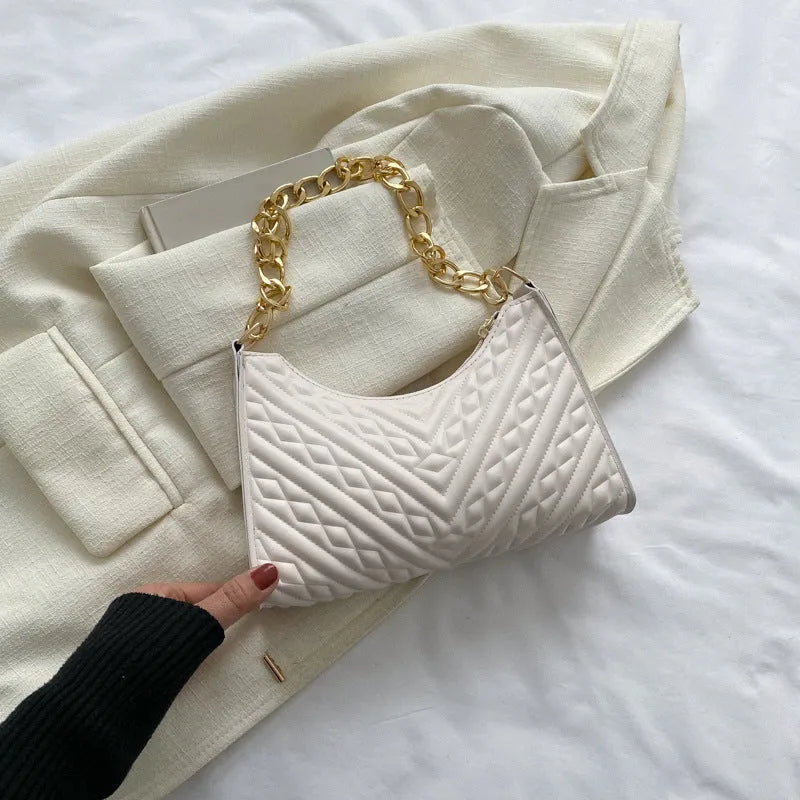 Brown pleated PU leather women's baguette shoulder bag with a chain strap and soft carry handle.