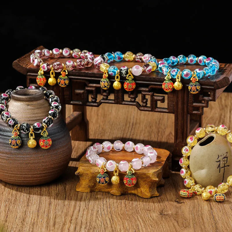 Handmade glass bracelet with swallow gold beast motifs and 10mm heart-shaped beads in multiple colour options