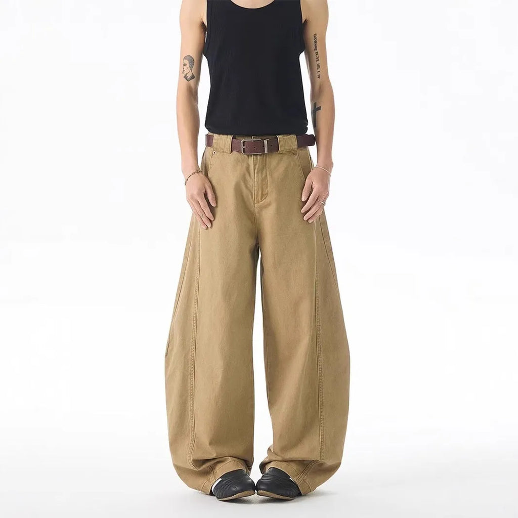 Men's brown loose fit straight leg casual jeans with a button fly and mid waist.