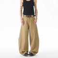 Men's brown loose fit straight leg casual jeans with a button fly and mid waist.