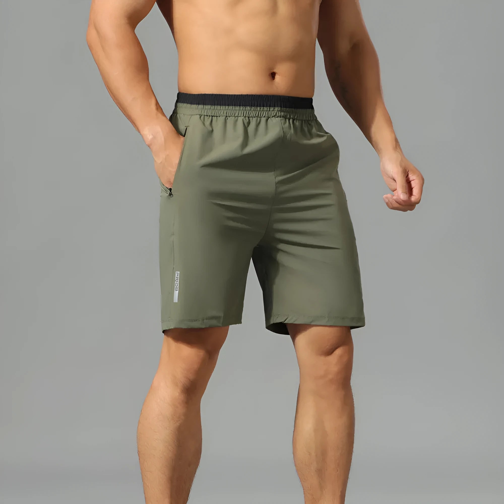 Men's loose grey Ice Silk cropped running pants on a plain background.