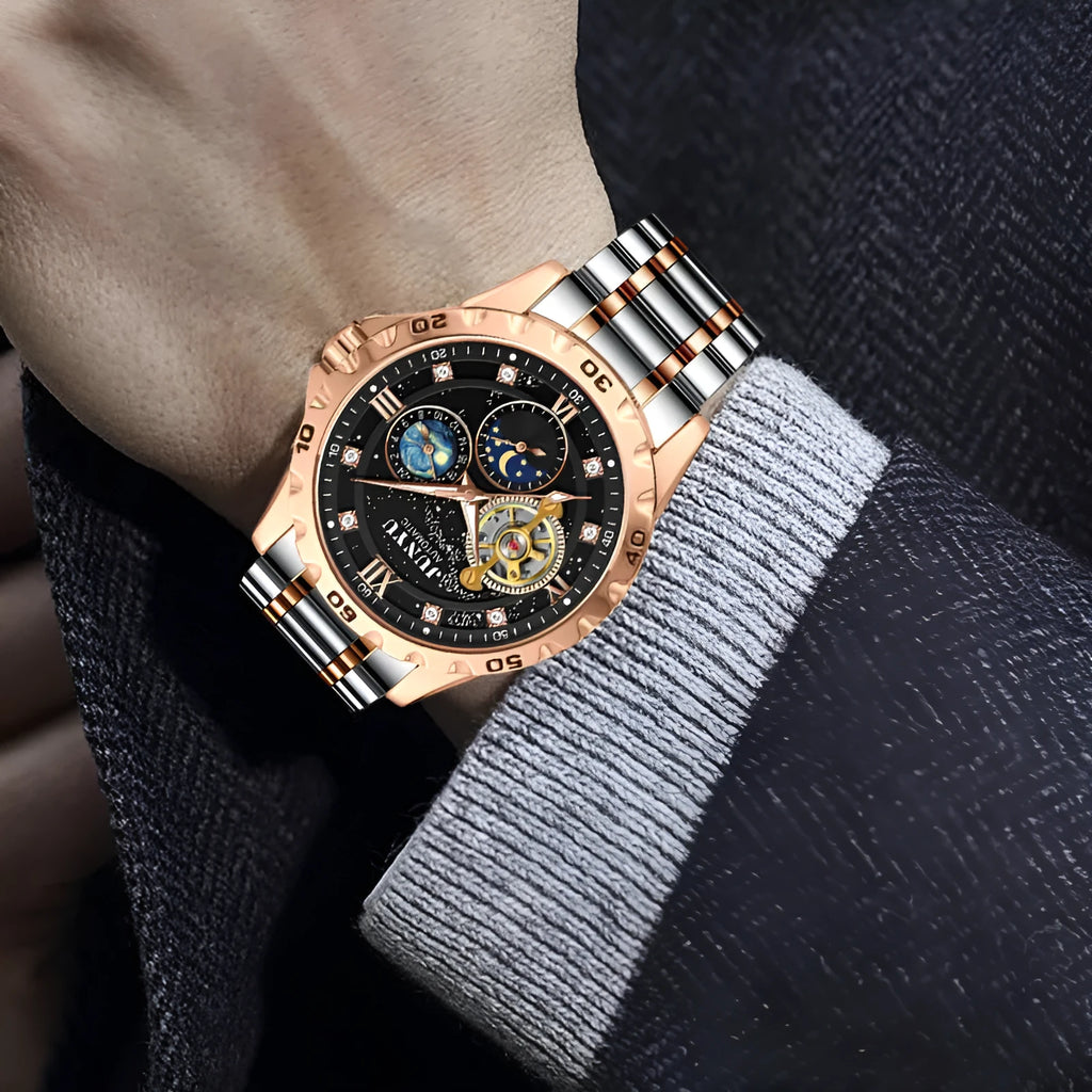 Automatic mechanical watch with silver case and black dial showing luminous markers