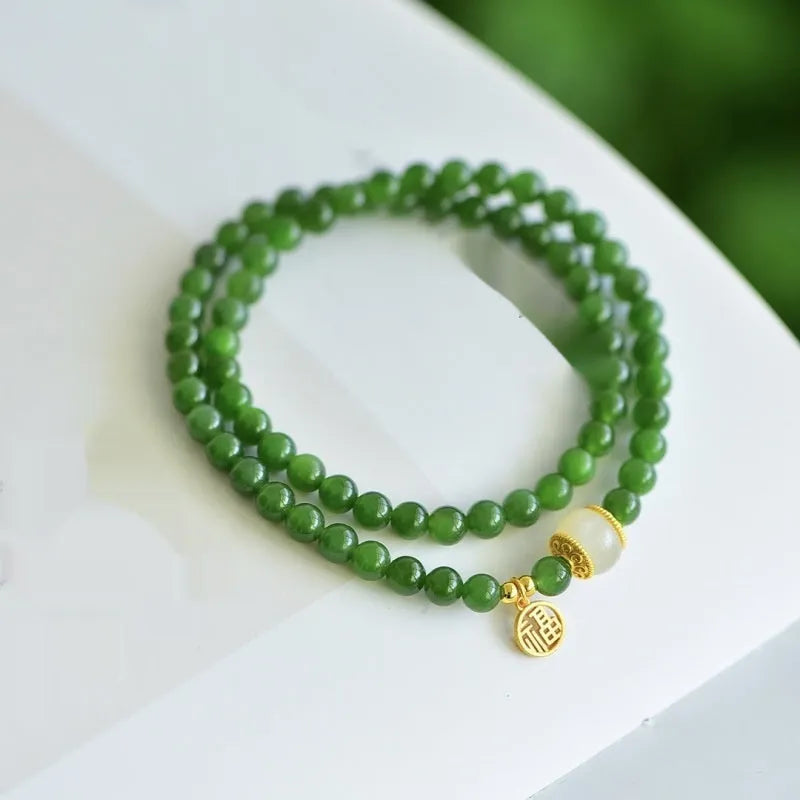 Women's double circle Hetian jade bracelet with engraved fu character in geometric design