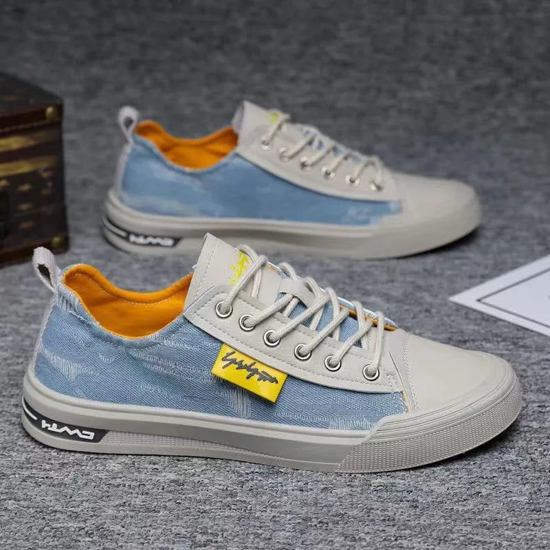 Men's dark blue canvas lace-up shoes with a round toe and white rubber sole on a neutral background.