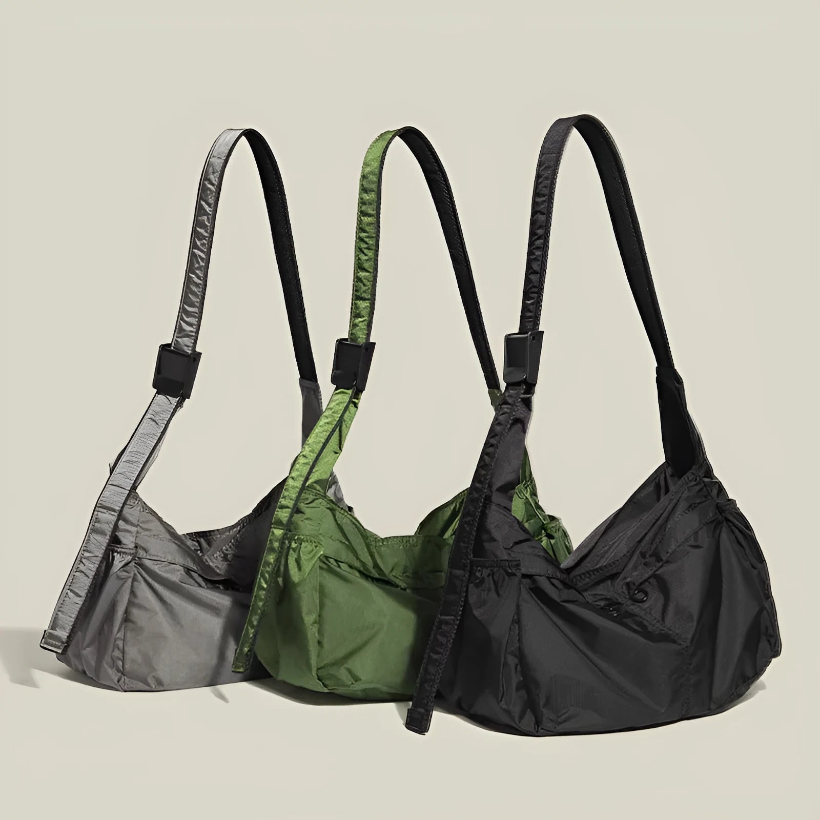 Large black nylon waterproof messenger bag with a single shoulder strap, shown open to reveal internal organisation.