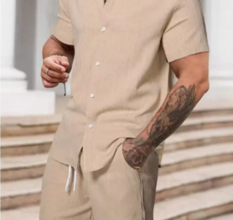 A striped printed casual suit for men, showing the short sleeve shirt and matching shorts on a hanger.
