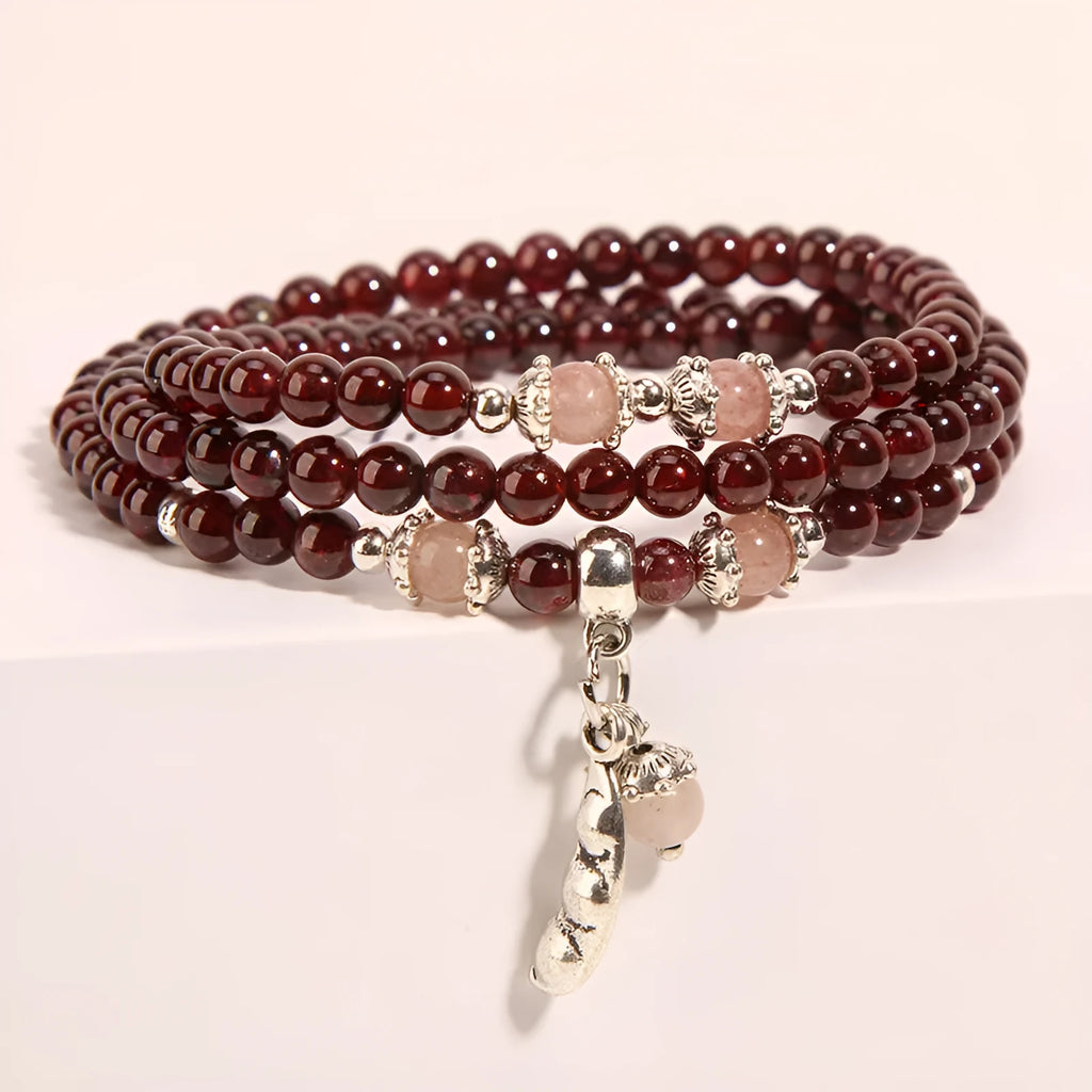 Women's wine red garnet crystal floral bracelet with bohemian design.