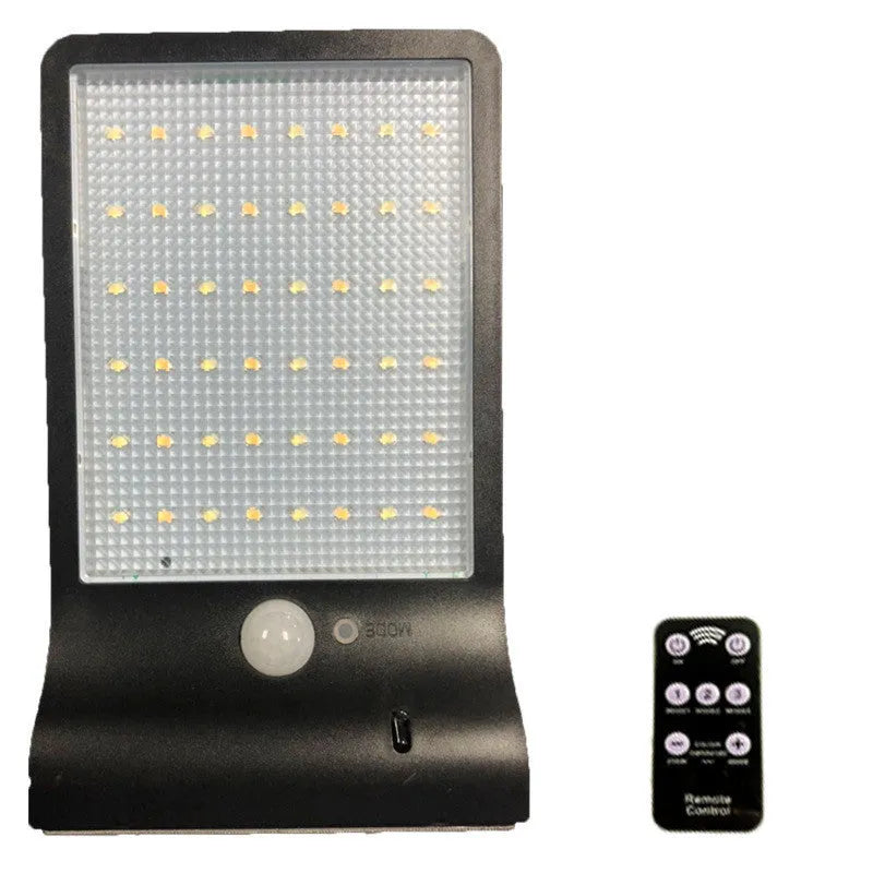 Black and white outdoor solar-powered garden light with LED illumination for pathways.