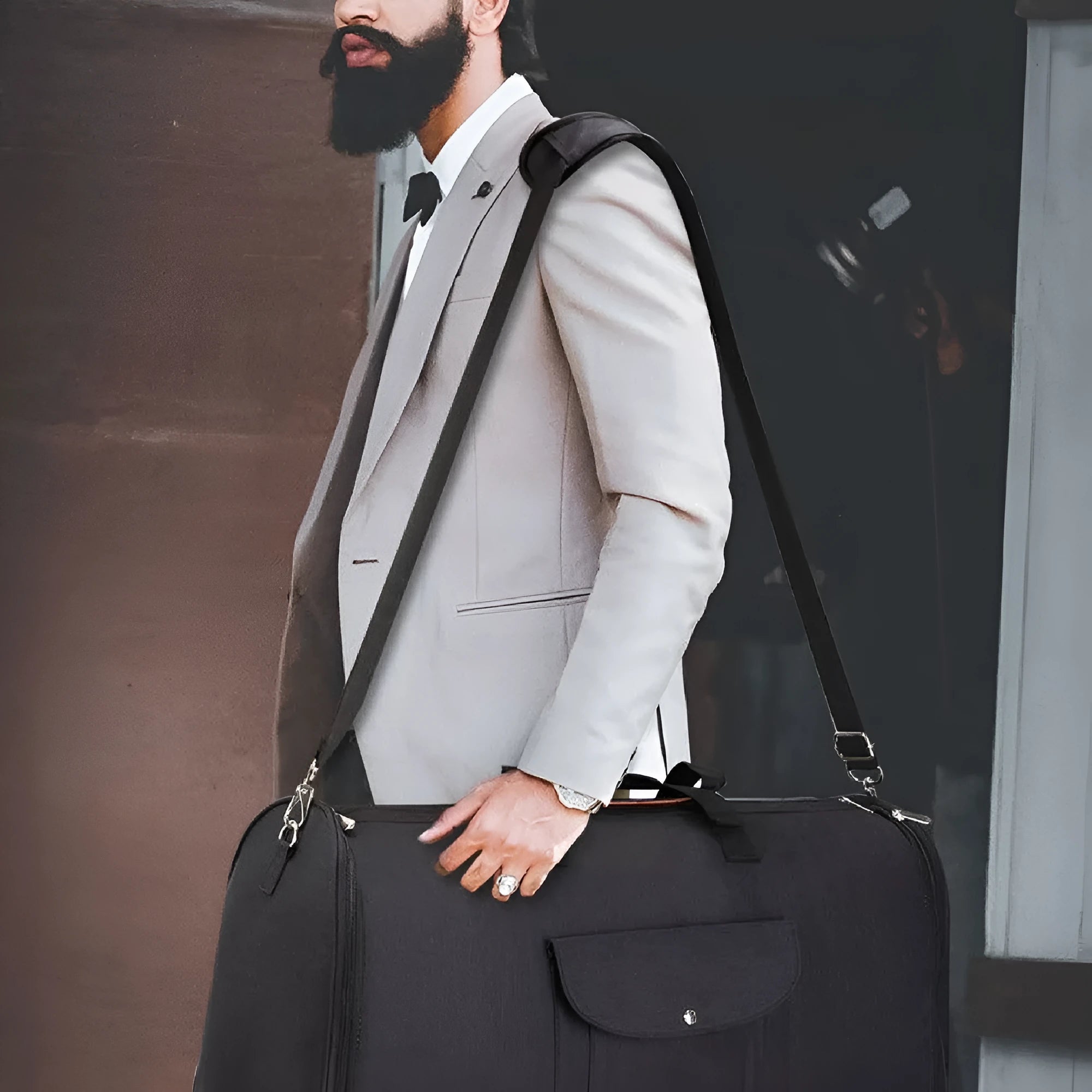 Folding dark blue Oxford cloth duffel bag with handles, shown upright and folded flat.