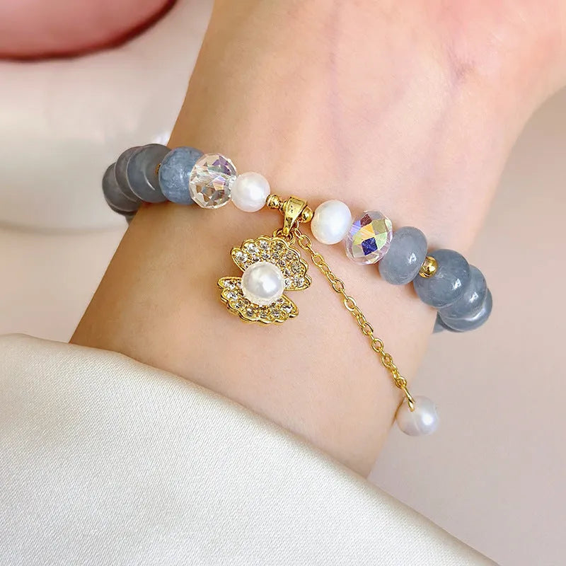 Handmade bracelet with a natural blue-green aquamarine pearl shell on an adjustable band.