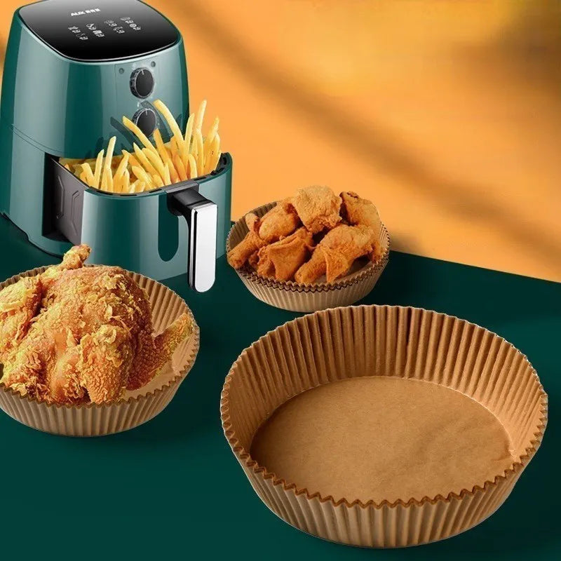 Round white disposable parchment paper liner for air fryer basket with raised edges.