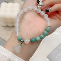 Women's retro Chinese style agate lotus seedpod bracelet with Burma jade accents on wrist