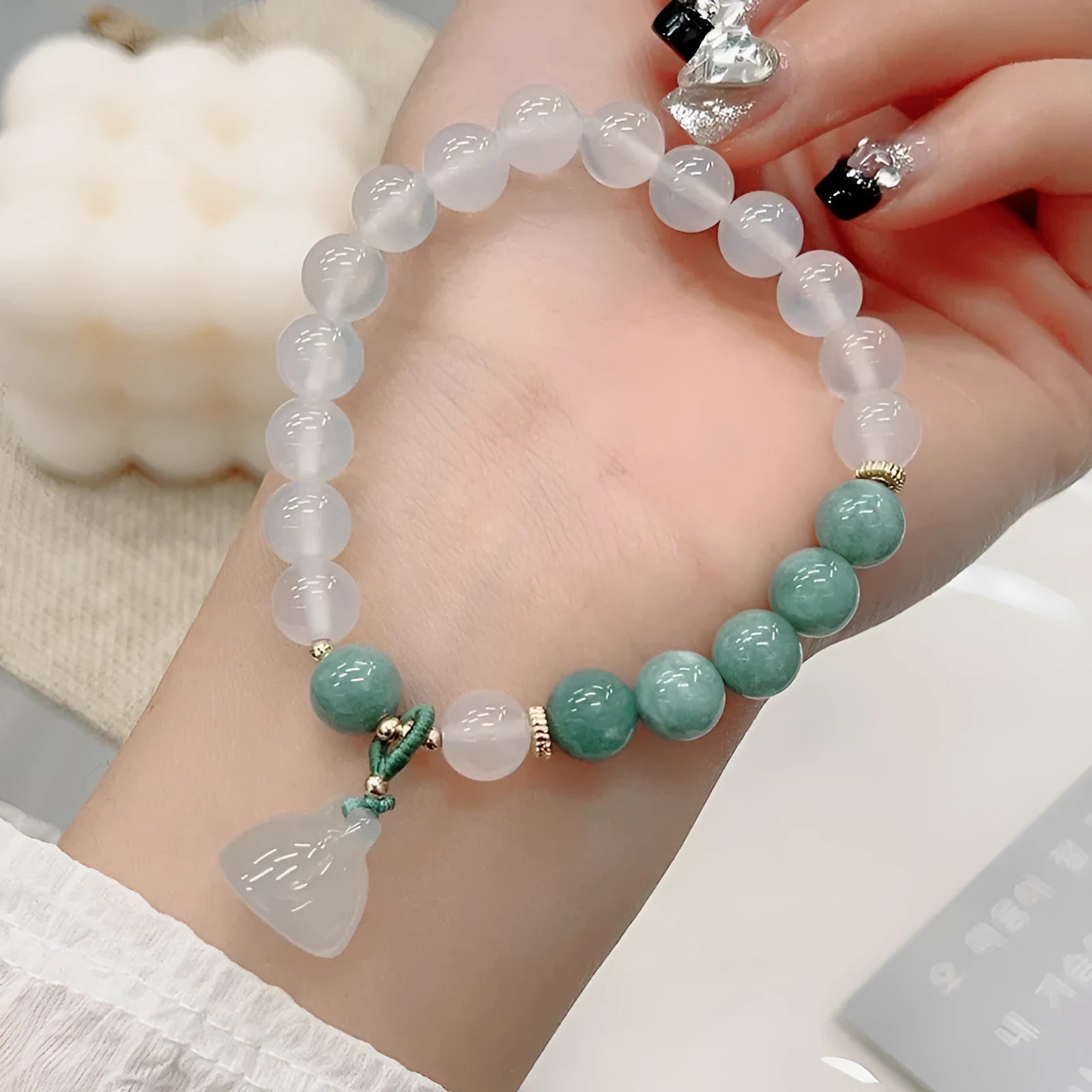 Women's retro Chinese style agate lotus seedpod bracelet with Burma jade accents on wrist